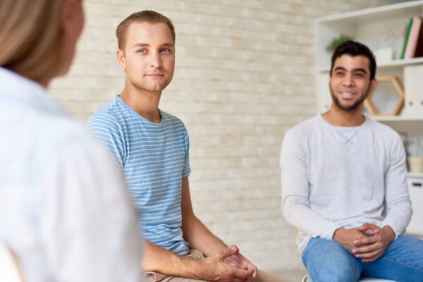 Two men sitting in talk therapy
