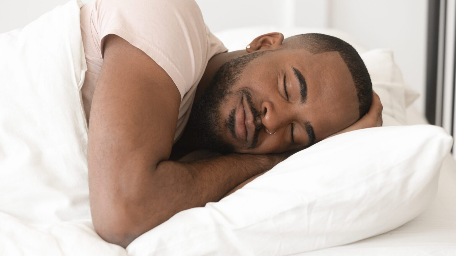 Man sleeping in a bed