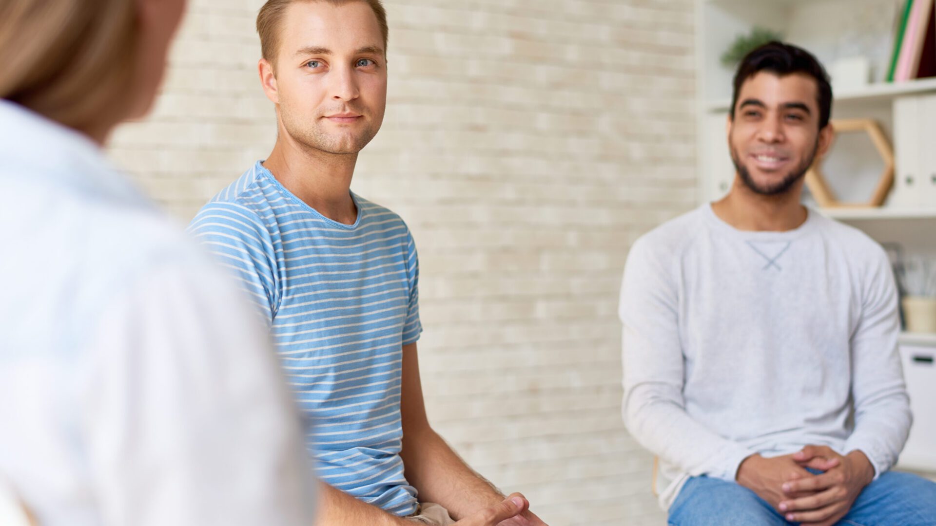 Two men sitting in talk therapy